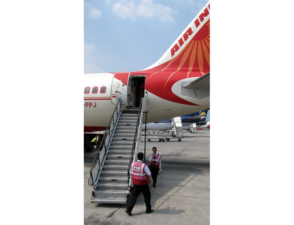 Stairs pulled up to rear door of plane