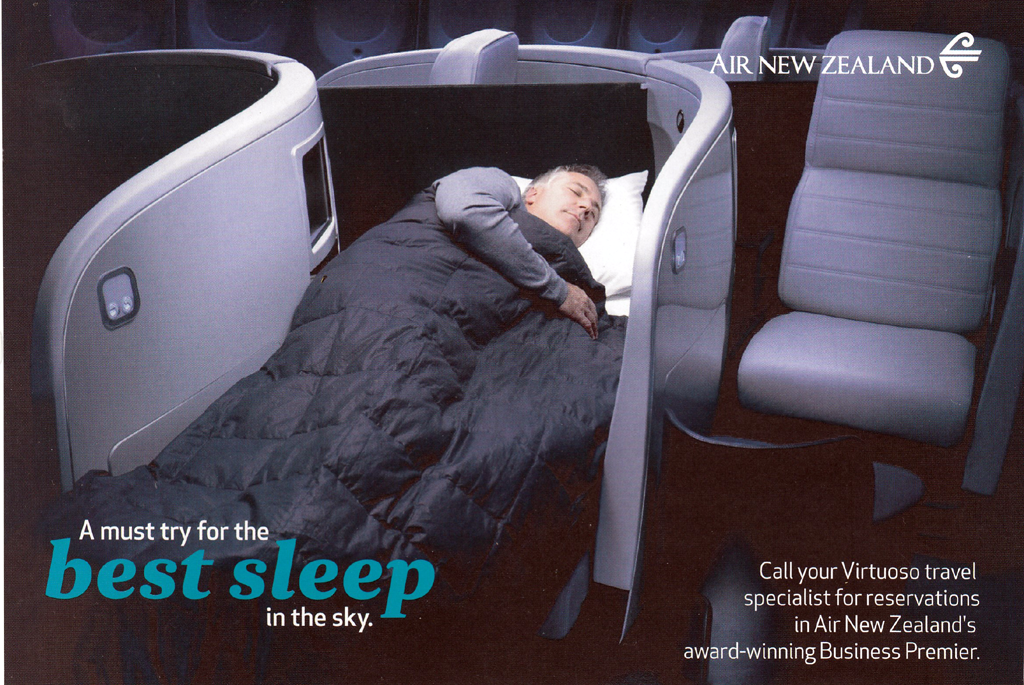 Man sleeping in Business Class seat