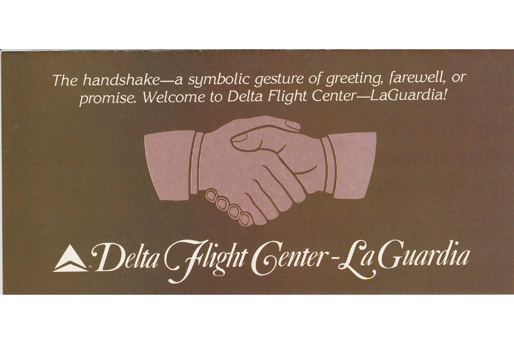 Hands shaking on cover of brochure
